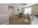 Bright upstairs office space featuring carpet and a well-lit workspace at 7652 Silver Baron Rd, Las Vegas, NV 89179