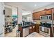 Well-equipped kitchen with modern appliances and an open view to the living area, perfect for entertaining at 7717 Pine Warbler Way, North Las Vegas, NV 89084