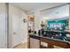 Modern kitchen with granite countertops, stainless steel appliances, and stylish cabinetry at 7717 Pine Warbler Way, North Las Vegas, NV 89084