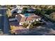 Expansive aerial view of a beautiful home with a pool, lush landscaping, and ample parking at 7745 Radcliff St, Las Vegas, NV 89123