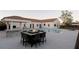 Gorgeous backyard featuring a pool, fire pit and covered outdoor kitchen at 7745 Radcliff St, Las Vegas, NV 89123