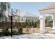 Basketball hoop with a view of the home's exterior and landscaped yard at 7745 Radcliff St, Las Vegas, NV 89123