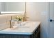 Bright bathroom features a double sink vanity with quartz countertop, modern fixtures, and a stylish LED mirror at 7745 Radcliff St, Las Vegas, NV 89123