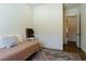 Bedroom features stylish area rug, and window with a view of the backyard at 7745 Radcliff St, Las Vegas, NV 89123