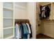 Walk-in closet with shelving and hanging rods to efficiently organize clothes at 7745 Radcliff St, Las Vegas, NV 89123
