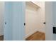 Walk-in closet with wood floors and open shelving at 7745 Radcliff St, Las Vegas, NV 89123