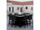 Backyard with a modern fire pit and chairs overlooking the swimming pool and outdoor area at 7745 Radcliff St, Las Vegas, NV 89123