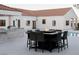 Outdoor entertaining area includes a modern fire pit and seating around the swimming pool at 7745 Radcliff St, Las Vegas, NV 89123