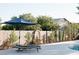 Landscaped backyard includes a charming fountain and mature shade trees for privacy at 7745 Radcliff St, Las Vegas, NV 89123
