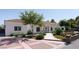 Inviting single-story home boasting a tile roof, manicured landscaping, and a patterned brick driveway for added curb appeal at 7745 Radcliff St, Las Vegas, NV 89123