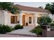 Inviting front porch with white columns and manicured landscaping at 7745 Radcliff St, Las Vegas, NV 89123