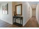 Hallway featuring wood floors, a console table with decor, and artwork at 7745 Radcliff St, Las Vegas, NV 89123