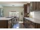 Well-lit kitchen boasts custom wood cabinetry, stainless steel appliances, and stylish fixtures for a modern cooking experience at 7745 Radcliff St, Las Vegas, NV 89123