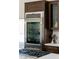 Stainless steel refrigerator integrated between wood kitchen cabinets and next to the gas stove at 7745 Radcliff St, Las Vegas, NV 89123
