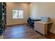 Office space featuring hardwood floors, a window, and a sewing machine table at 7745 Radcliff St, Las Vegas, NV 89123
