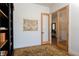 View from the office highlighting the wood-framed sliding glass doors, decor, and patterned rug at 7745 Radcliff St, Las Vegas, NV 89123