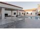 Luxury outdoor kitchen boasts stainless steel grill, bar seating, and granite countertops at 7745 Radcliff St, Las Vegas, NV 89123