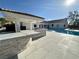 Outdoor kitchen, poolside bar, and pristine pool complete this incredible backyard perfect for outdoor entertaining and relaxation at 7745 Radcliff St, Las Vegas, NV 89123