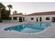Gorgeous pool area with a jacuzzi, cabana, and manicured landscaping at 7745 Radcliff St, Las Vegas, NV 89123