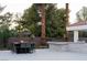 Backyard features a pool, outdoor kitchen, and dining table at 7745 Radcliff St, Las Vegas, NV 89123