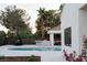 Backyard with swimming pool, cabana, outdoor kitchen and dining area at 7745 Radcliff St, Las Vegas, NV 89123