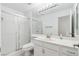 All-white bathroom with walk-in shower, large mirror, and modern fixtures at 8113 Blue Cascade Ave, Las Vegas, NV 89128