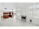 Open kitchen features custom cabinetry, granite countertops, and a fireplace at 8113 Blue Cascade Ave, Las Vegas, NV 89128