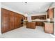 Spacious kitchen with granite counters, wood cabinets, and stainless steel appliances at 8113 Blue Cascade Ave, Las Vegas, NV 89128