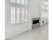 Bright living room featuring a fireplace and windows with plantation shutters at 8113 Blue Cascade Ave, Las Vegas, NV 89128