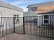 Fenced backyard features secure gate and minimal landscaping at 817 Stewart Ave, Las Vegas, NV 89101