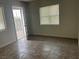 Bedroom features tiled flooring and large windows providing plenty of natural light at 817 Stewart Ave, Las Vegas, NV 89101