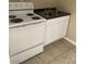 Galley-style kitchen with white stove and stainless steel sink at 817 Stewart Ave, Las Vegas, NV 89101