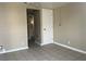 Neutral room with tiled flooring offering a glimpse into the bathroom at 817 Stewart Ave, Las Vegas, NV 89101