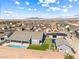 A backyard featuring a covered patio, swimming pool, basketball court and putting green at 8840 Harvest Sunset St, Las Vegas, NV 89113