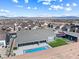The aerial view shows a home, pool, sports court, and manicured yard within a vibrant neighborhood at 8840 Harvest Sunset St, Las Vegas, NV 89113