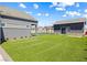 Large backyard with pavers, artificial grass, and a basketball court at 8840 Harvest Sunset St, Las Vegas, NV 89113