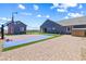 Spacious backyard featuring a basketball court, detached structure and paved patio at 8840 Harvest Sunset St, Las Vegas, NV 89113