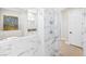 Elegant bathroom featuring a marble tile shower and modern fixtures at 8840 Harvest Sunset St, Las Vegas, NV 89113