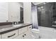 Modern bathroom with dark subway tile, shower-tub combination, and sleek vanity at 8840 Harvest Sunset St, Las Vegas, NV 89113