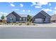 Beautiful single-story home featuring a three-car garage and modern landscaping at 8840 Harvest Sunset St, Las Vegas, NV 89113