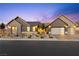 Charming single-story home featuring a three-car garage and beautifully landscaped front yard at 8840 Harvest Sunset St, Las Vegas, NV 89113