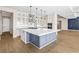 Spacious kitchen features a large island, modern appliances, and sleek countertops at 8840 Harvest Sunset St, Las Vegas, NV 89113