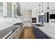 Well-equipped kitchen featuring a large island, modern appliances, and stylish countertops at 8840 Harvest Sunset St, Las Vegas, NV 89113