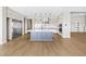 Chef's kitchen with stainless steel appliances, blue island, and stylish countertops at 8840 Harvest Sunset St, Las Vegas, NV 89113