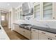 Well-designed kitchen with a range, stainless steel range hood and modern countertops at 8840 Harvest Sunset St, Las Vegas, NV 89113