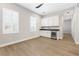 Sunlit living room with white cabinets, gray countertops, and wine cooler at 8840 Harvest Sunset St, Las Vegas, NV 89113