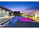Enjoy a private pool with a built-in spa and beautifully landscaped backyard with accent lighting at 8840 Harvest Sunset St, Las Vegas, NV 89113