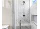 Walk-in shower with floor to ceiling tile and a built-in bench at 8840 Harvest Sunset St, Las Vegas, NV 89113