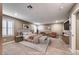 Virtually staged bedroom with neutral carpeting, shutters, a ceiling fan, and comfortable decor at 928 Riverlawn Pl, Las Vegas, NV 89138