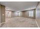 Large bonus room with neutral carpeting, plantation shutters, and recessed lighting at 928 Riverlawn Pl, Las Vegas, NV 89138